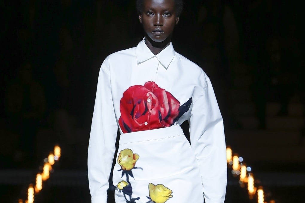 A model shows a Prada flower-appliqué dress on the catwalk at Milan Fashion Week. This will be the look of autumn and winter 2019.
