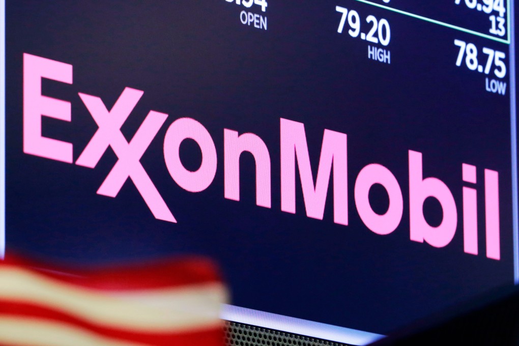 The logo for ExxonMobil above a trading post on the floor of the New York Stock Exchange. Photo: AP