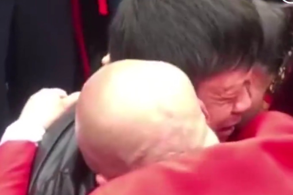 The tearful moment a man is finally reunited with his parents 31 years after he was abducted as a three-year-old. Photo: Weibo