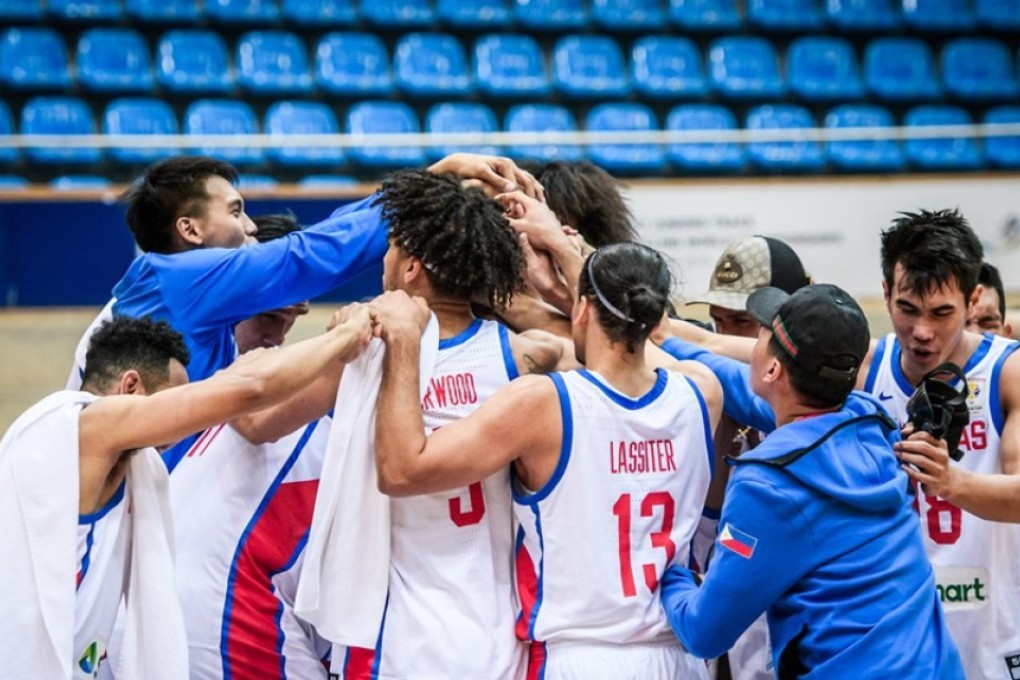 Gilas Pilipinas players celebrate their victory over Kazakhstan. Photo: Fiba