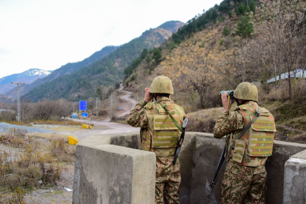 Pakistani soldiers monitor Indian troops near the Pakistan-India border on Saturday. Photo: AFP