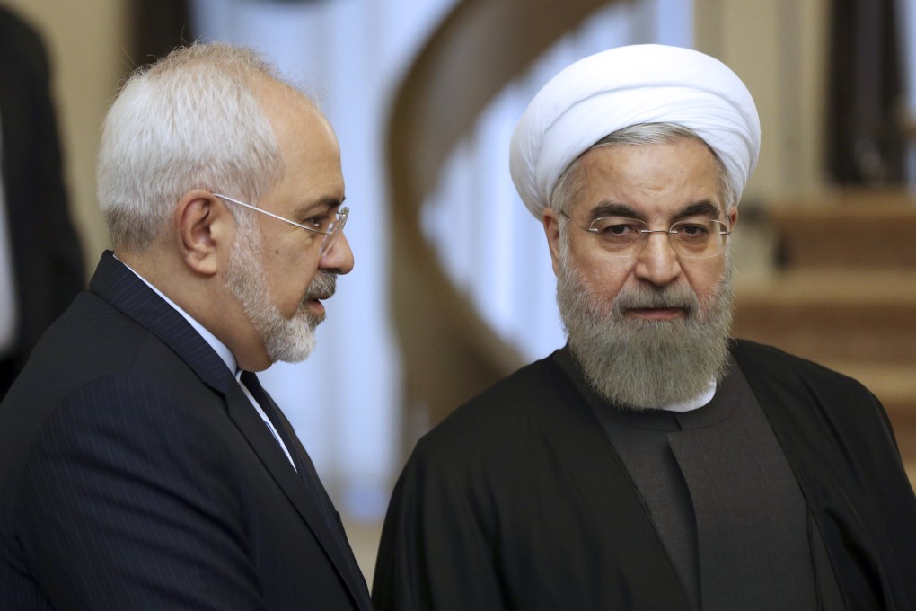 Iranian President Hassan Rowhani, right, listens to his Foreign Minister Mohammad Javad Zarif prior to a meeting in Tehran. Photo: AP photo
