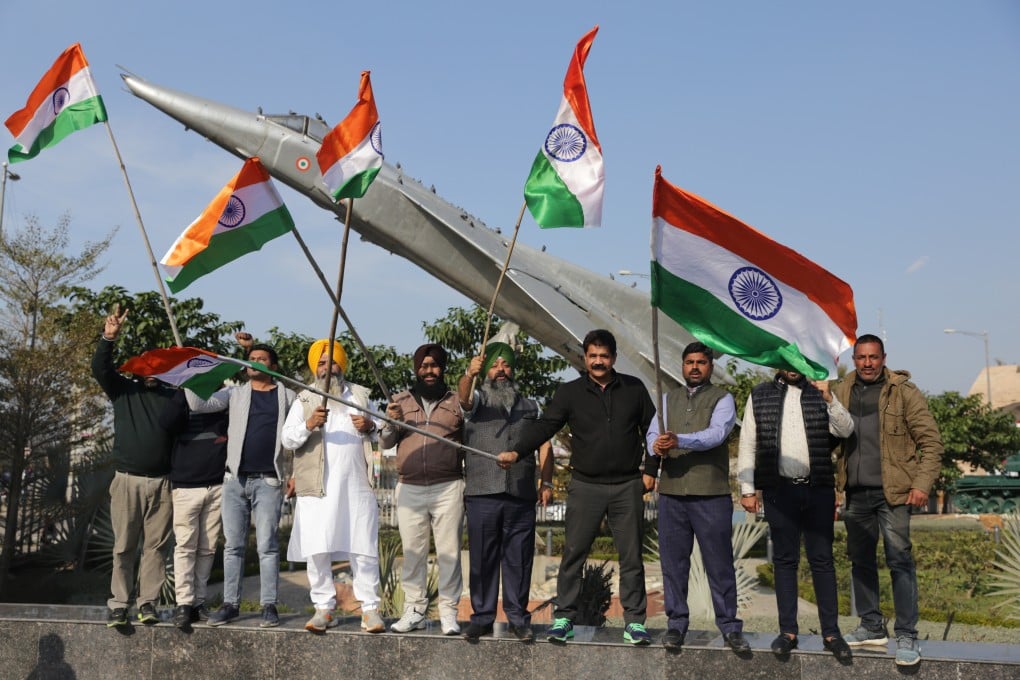 Workers with India’s ruling Bhartiya Janta Party celebrate the air strike. Photo: EPA