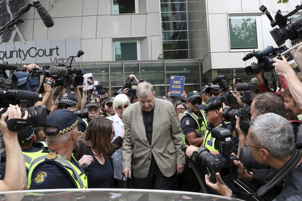 Cardinal George Pell, center, leaves the County Court in Melbourne on Feruary 26, 2019. Photo: AP