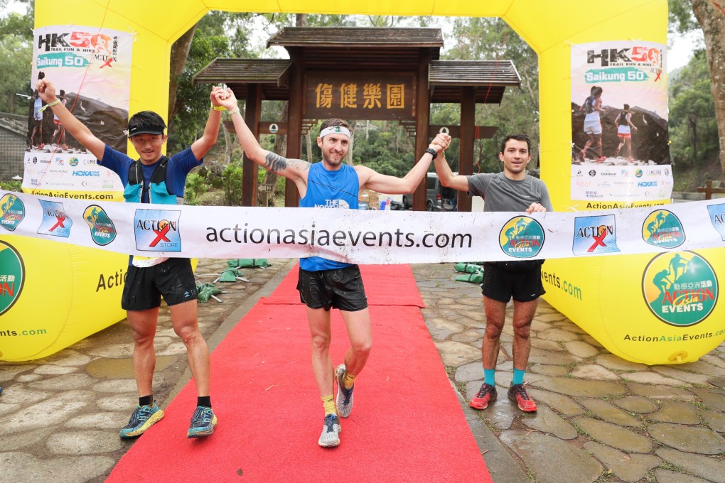 Bin Lang, Vlad Ixel and Adrian Konareff cross the finish line in joint second after losing their way thanks to markers being sabotaged in the Sai Kung 50. Photo: Action Asia