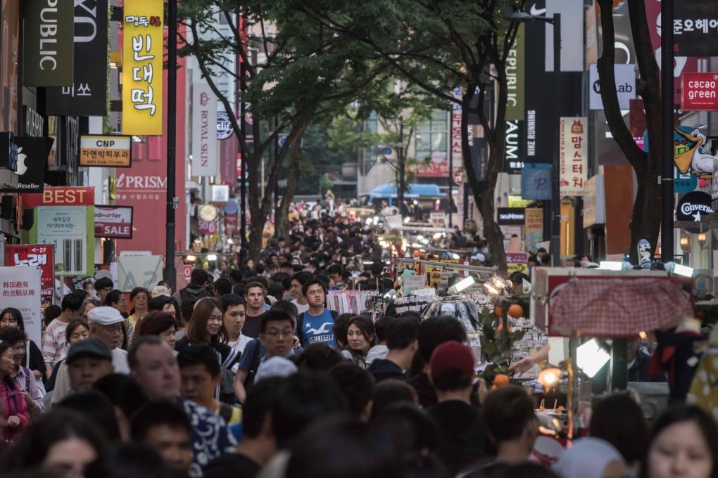 Shoppers in the popular Myeongdong shopping area of Seoul. AFP PHOTO