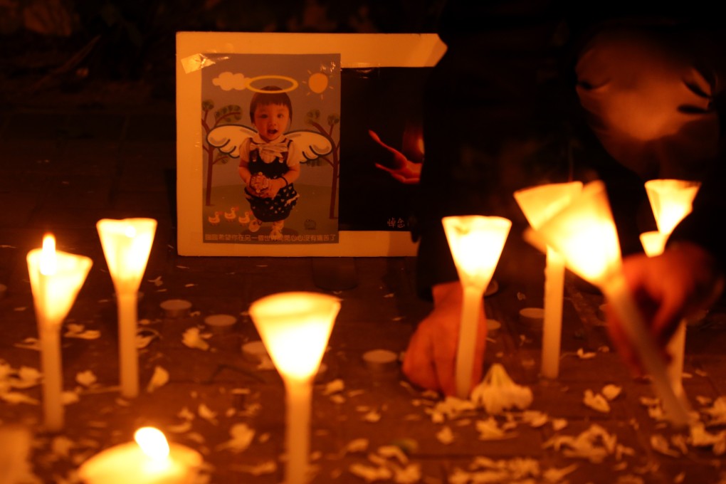 Mourners take part in a candlelight memorial ceremony for five-year-old Chan Sui-lam, who died after being thrown at the ceiling and poked in the chest with scissors. Her father and stepmother were arrested for child abuse. Photo: Handout