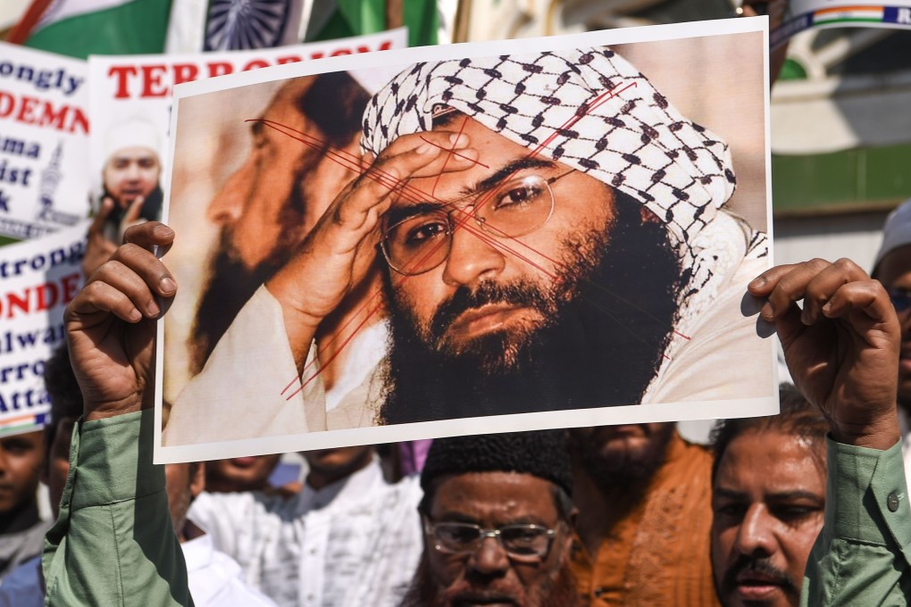 Indian Muslims hold a scratched photo of Jaish-e-Mohammad chief Maulana Masood Azhar during a protest in Mumbai after a suicide bomb attack in Kashmir by the group. Photo: AFP