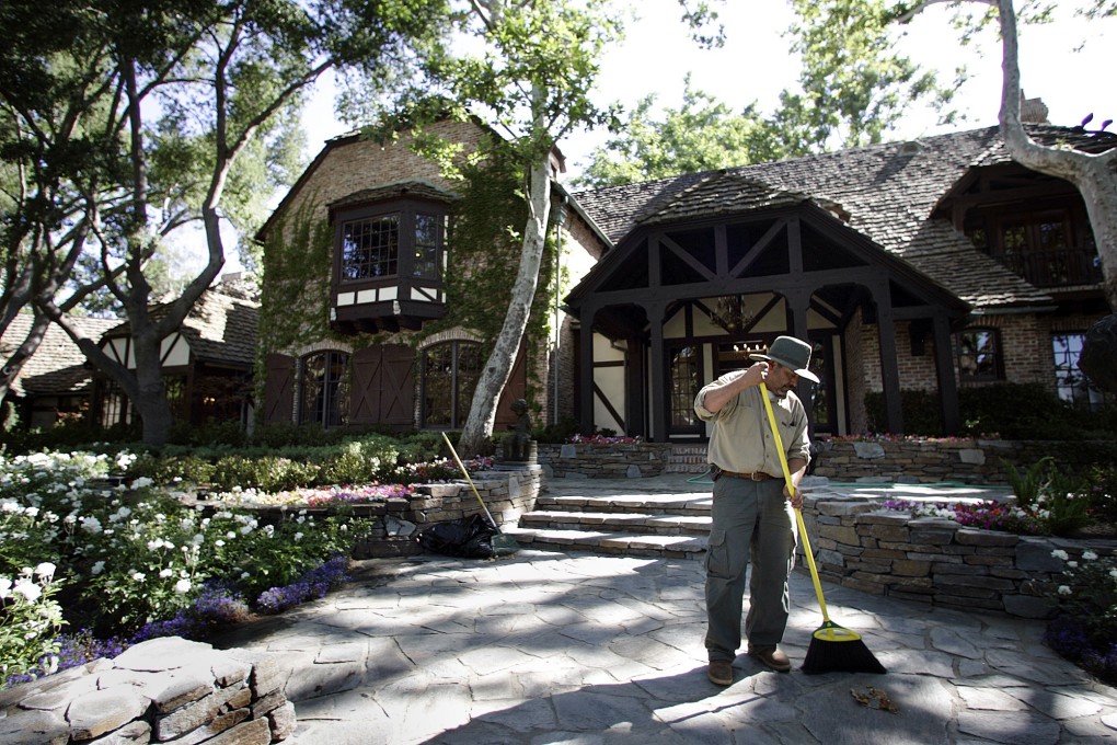 A worker sweeping at ‘Neverland Ranch’ in Los Olivos, California in July 2009. Photo: TNS