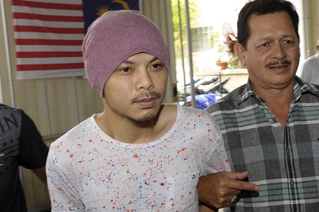 Rapper Namewee, or Wee Meng Chee, left, is arrested over his 2018 video for Like a Dog. Photo: AP