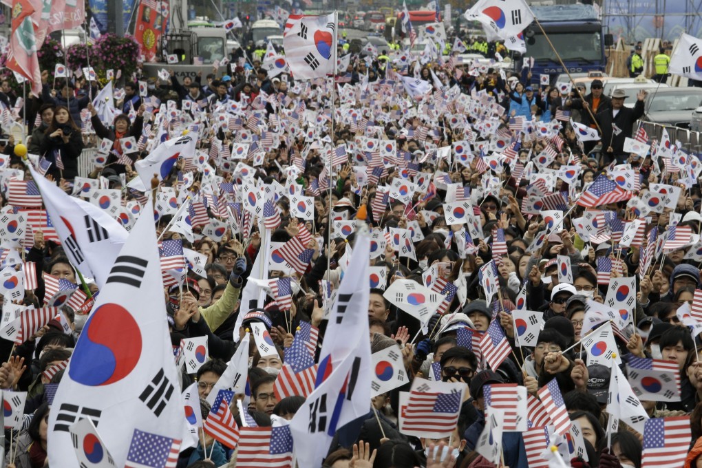 Protesters wave South Korean and US flags during a rally denouncing South Korean President Moon Jae-in in Seoul in November 2018. Moon’s once sky-high approval ratings have fallen to earth over the country’s economic performance, and his support for negotiations between Donald Trump and Kim Jong-un have not paid off so far. Photo: AP