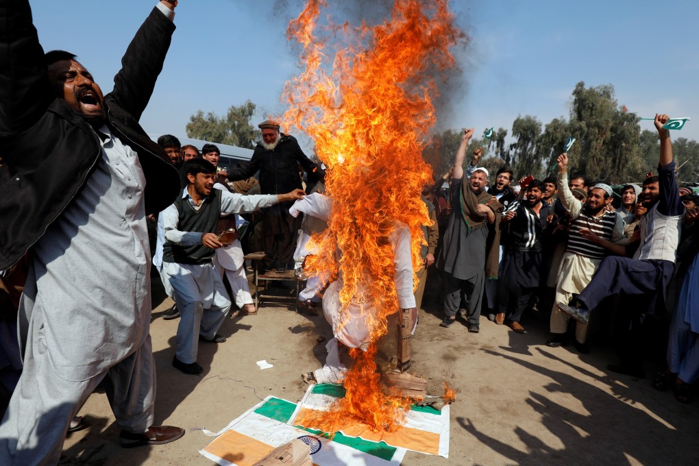 Protesters in Peshawar, Pakistan, burn the Indian flag and an effigy of Indian Prime Minister Narendra Modi on February 28, after Pakistani officials said the country had shot down two Indian warplanes. Photo: Reuters
