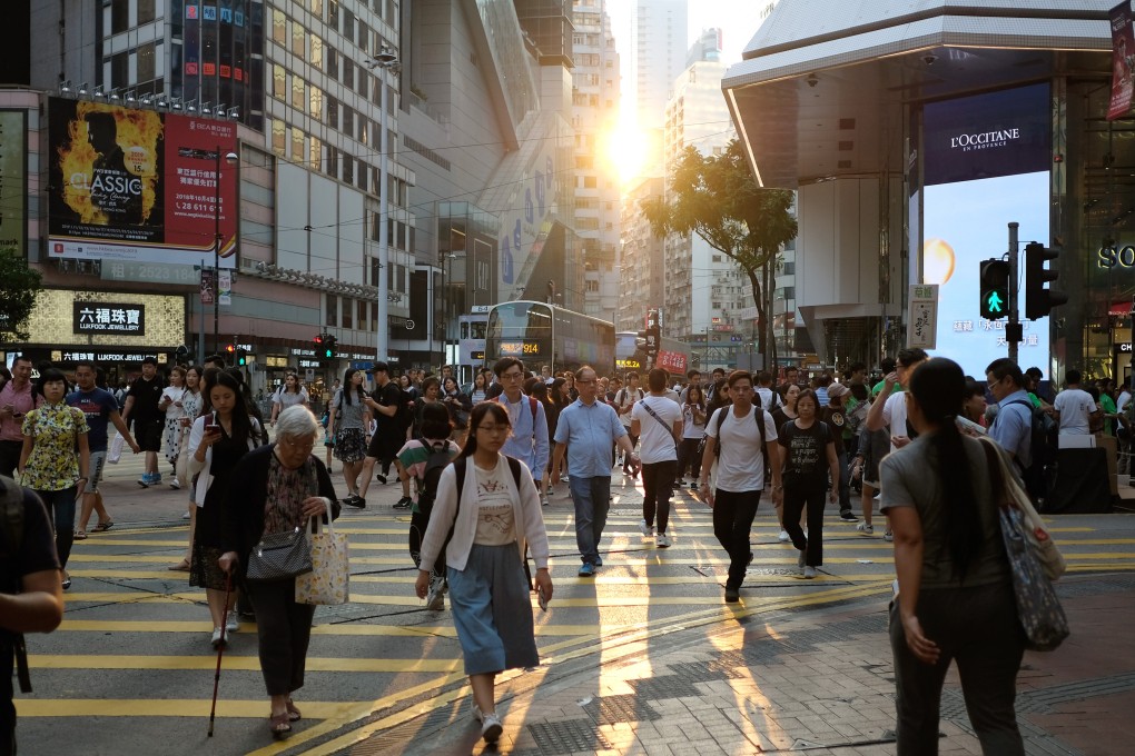 Hongkongers from different generations cross the road in Causeway Bay. Photo: Fung Chang