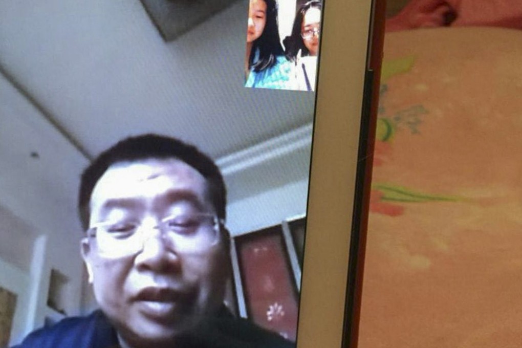 Jiang Tianyong, seen during a video call with his wife Jin Bianling and their daughter, who live in Los Angeles, is back at his parents’ home in Henan province. Photo: Handout