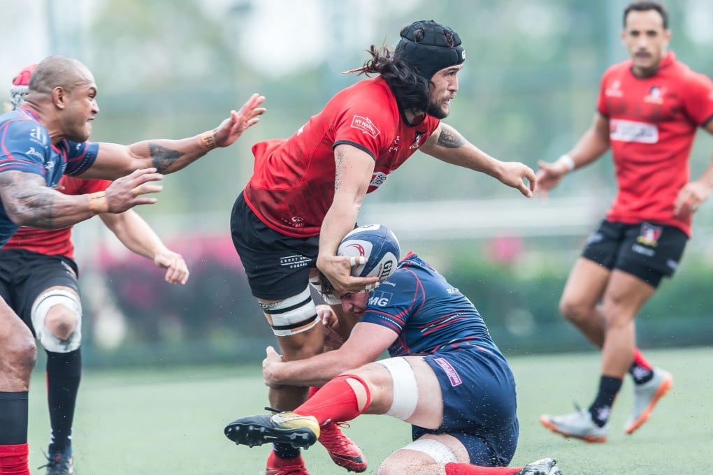 Karetai Williams looks to offload the ball against HK Scottish. Photo: HKRU