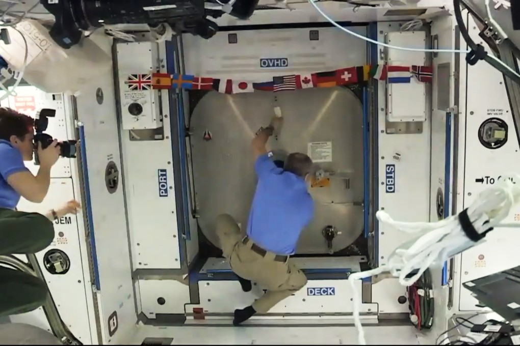 Astronauts on the International Space Station prepare to open the hatch to the SpaceX Dragon capsule on March 3, 2019. Photo: EPA/Nasa TV