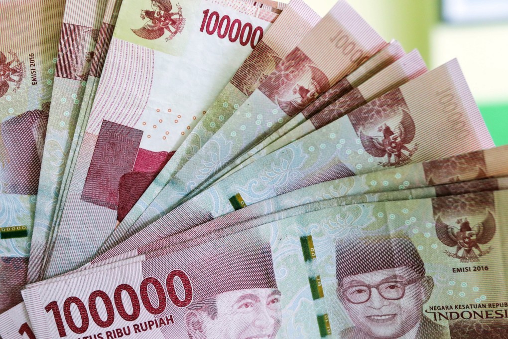 In Indonesia, minimum wages vary by regions, ranging from US$107 in Yogyakarta to US$222 in Papua – so interest quickly results in debts becoming unbearable. Photo: EPA-EFE