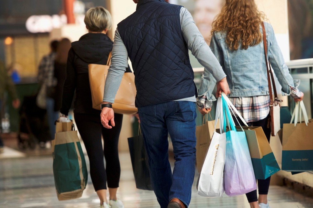 American malls continue to struggle to stay relevant in a retail world increasingly dominated by online sales. Here, shoppers carry bags of merchandise at the King of Prussia Mall, the largest retail shopping space in the US, in King of Prussia, Pennsylvania on December 8, 2018. Photo: Reuters