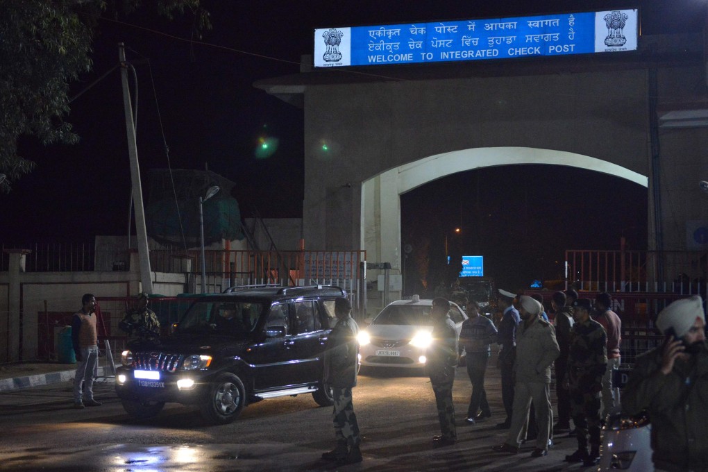 The convoy transferring Indian pilot Abhinandan Varthaman arrives at the Wagah border. Photo: AFP