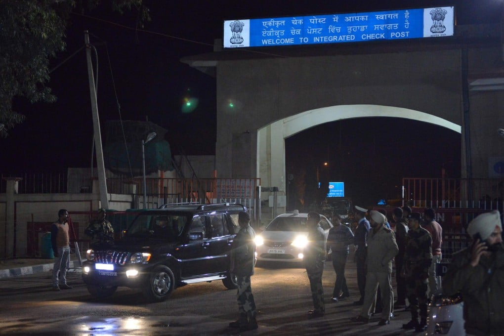 The convoy transferring Indian pilot Abhinandan Varthaman arrives at the Wagah border. Photo: AFP