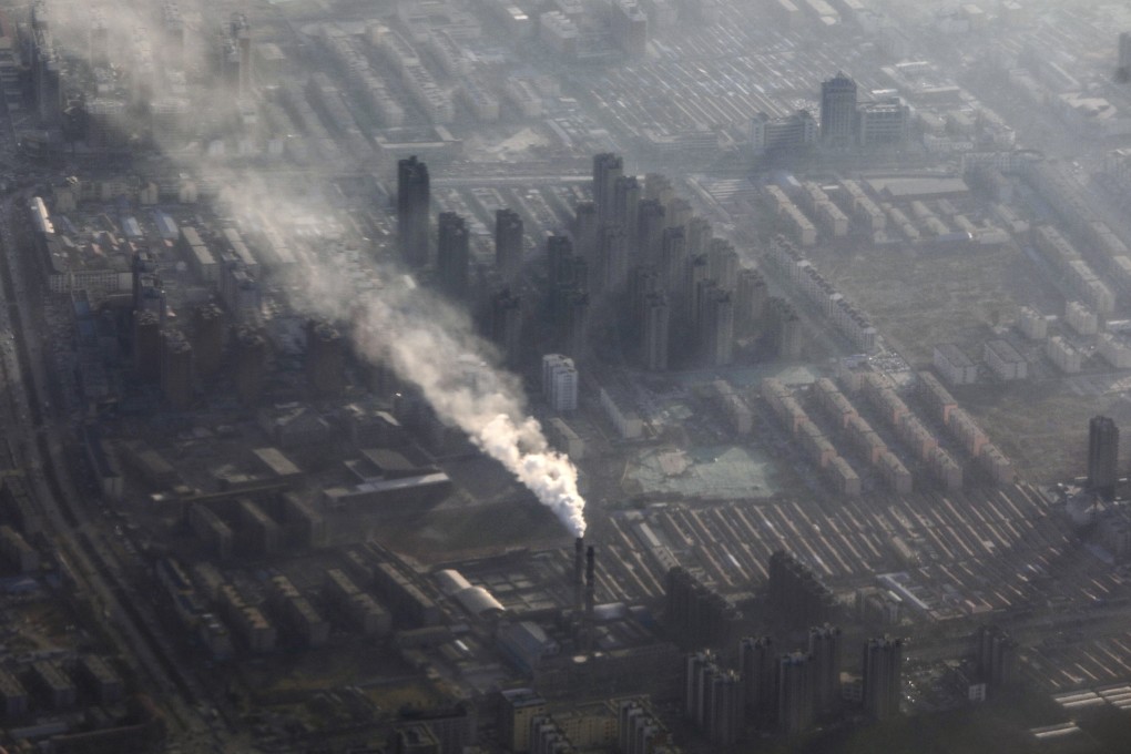 Smoke rises from chimneys in Hebei province, which surrounds Beijing, on a polluted day in January this year. Photo: Simon Song