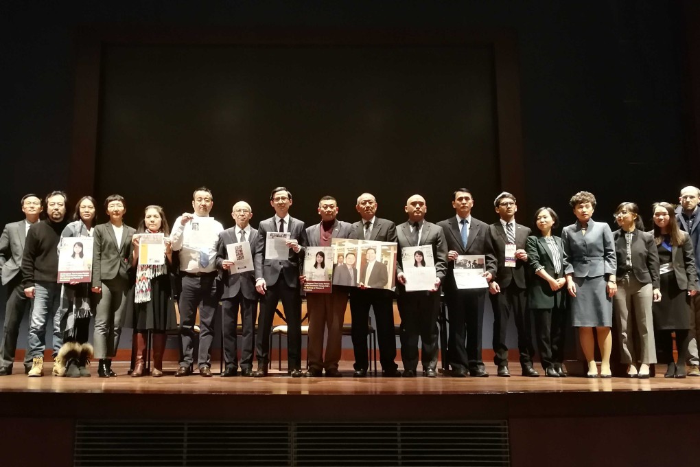 Members of the Coalition to Advance Religious Freedom in China announce the alliance’s formation, holding photos of Chinese citizens allegedly persecuted for their faith. Photo: Owen Churchill