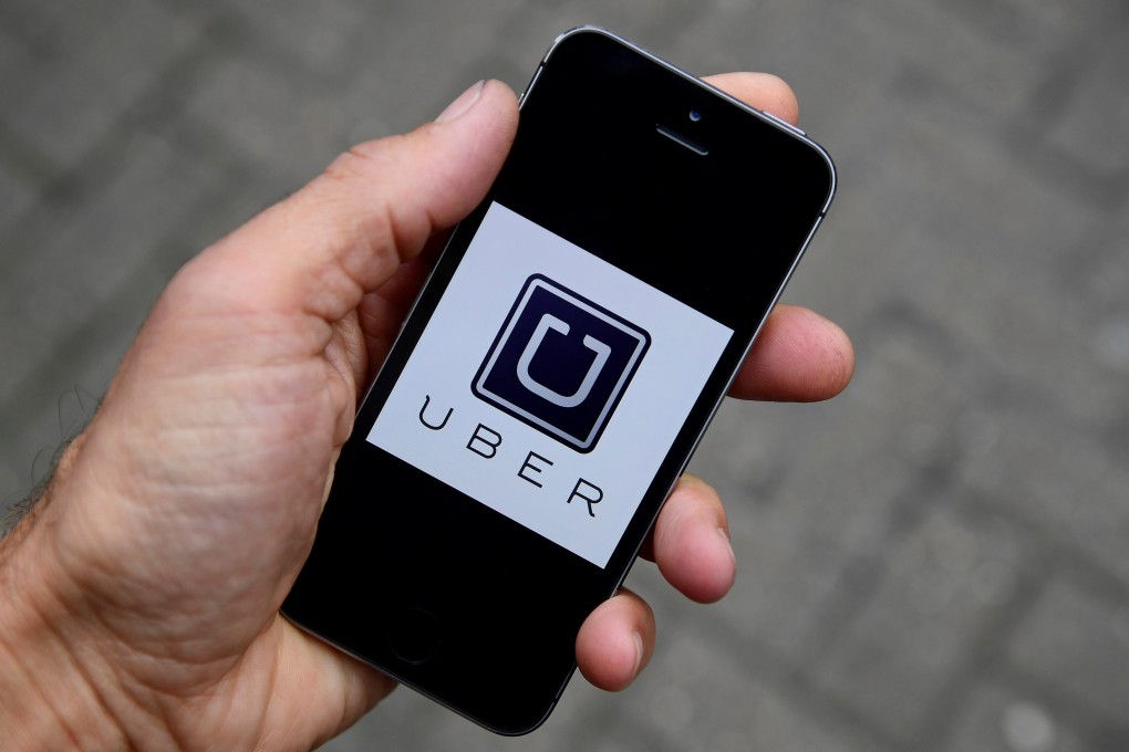 The owner of a Hong Kong taxi fleet who planned to pair with Uber had to give up after threats were reportedly made to his family. Photo: Reuters