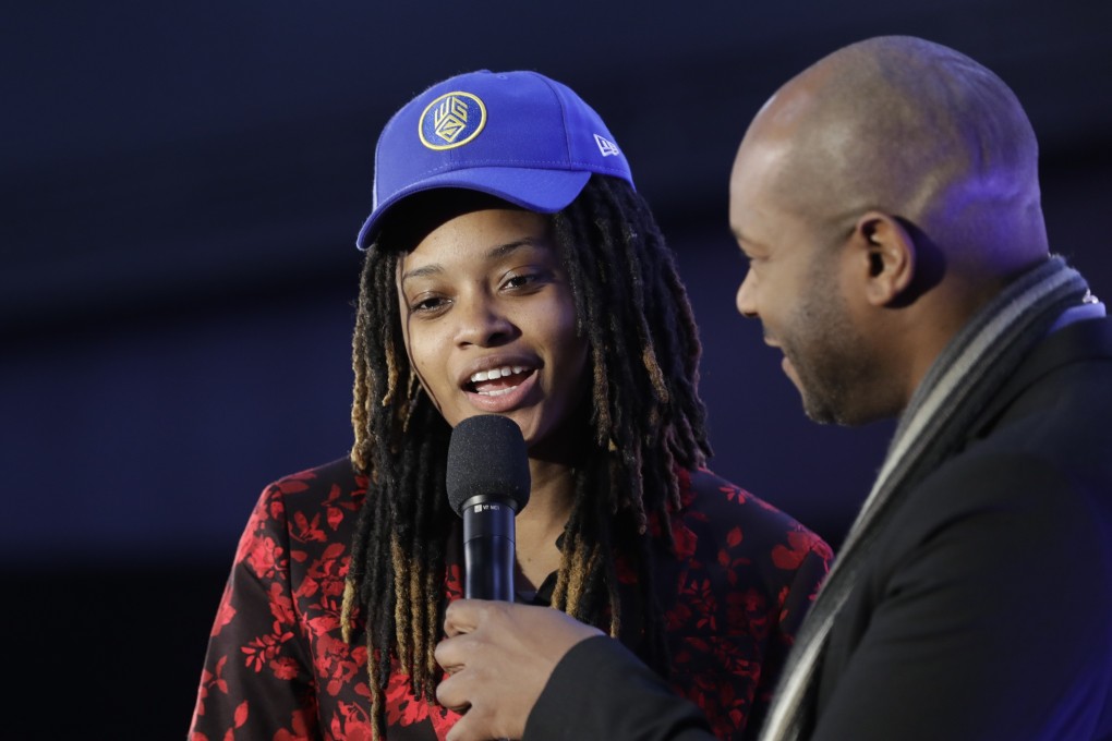 Chiquita Evans on stage after being selected as the 56th pick overall by the Warriors Gaming Squad at the NBA 2K League draft. Photo: AP