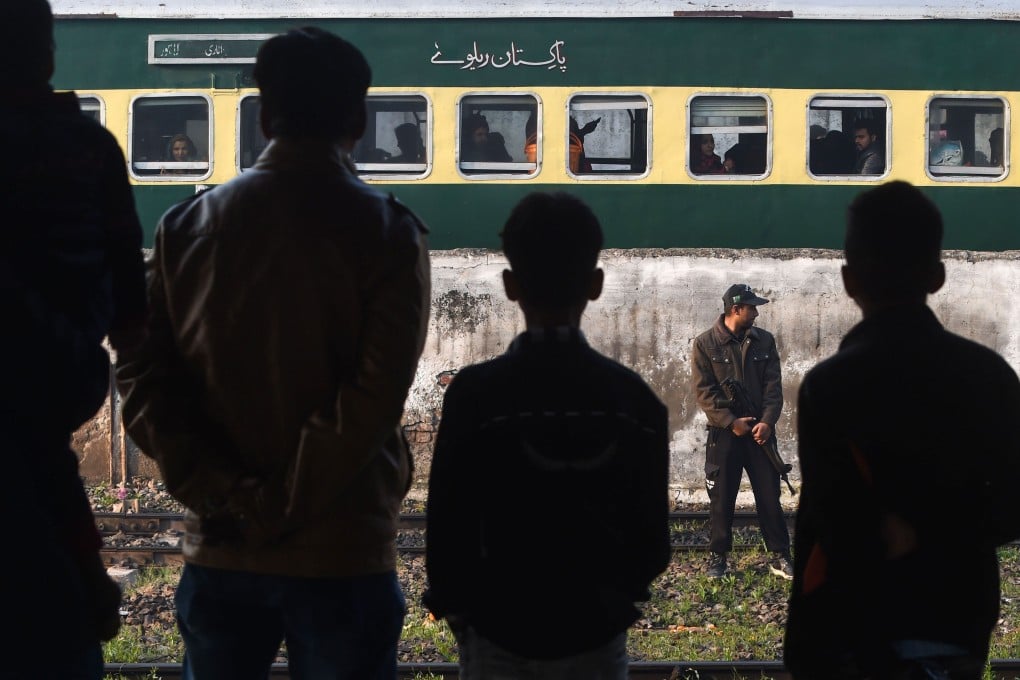 A Pakistani policeman stands guard at Lahore railway station, near a train travelling to India, on February 25, 2019. The vast majority of Indians and Pakistanis do not want war or bad relations. Photo: AFP