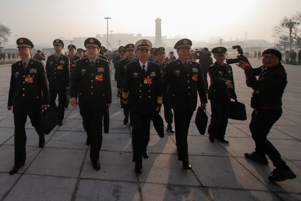 Military delegates arrive at the Great Hall of the People for the National People’s Congress on Tuesday. Photo: Reuters