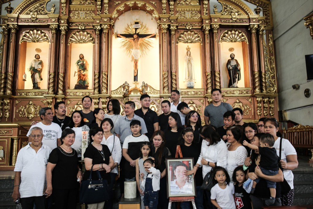 Ferdinand Jhon Santos’ family gather for a mass on January 22 before his ashes are taken to the family mausoleum at a cemetery in San Jose del Monte, Bulacan, in the Philippines. Photo: Lynzy Billing