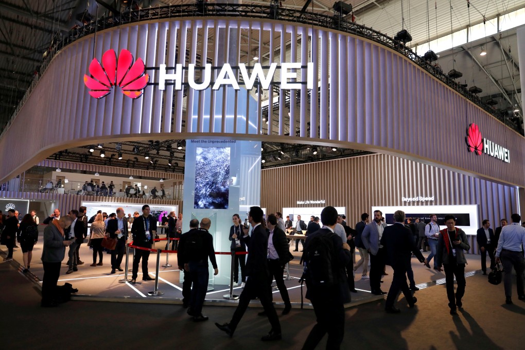 Visitors walk next to Huawei booth at the Mobile World Congress in Barcelona, Spain on February 27. Photo: Reuters