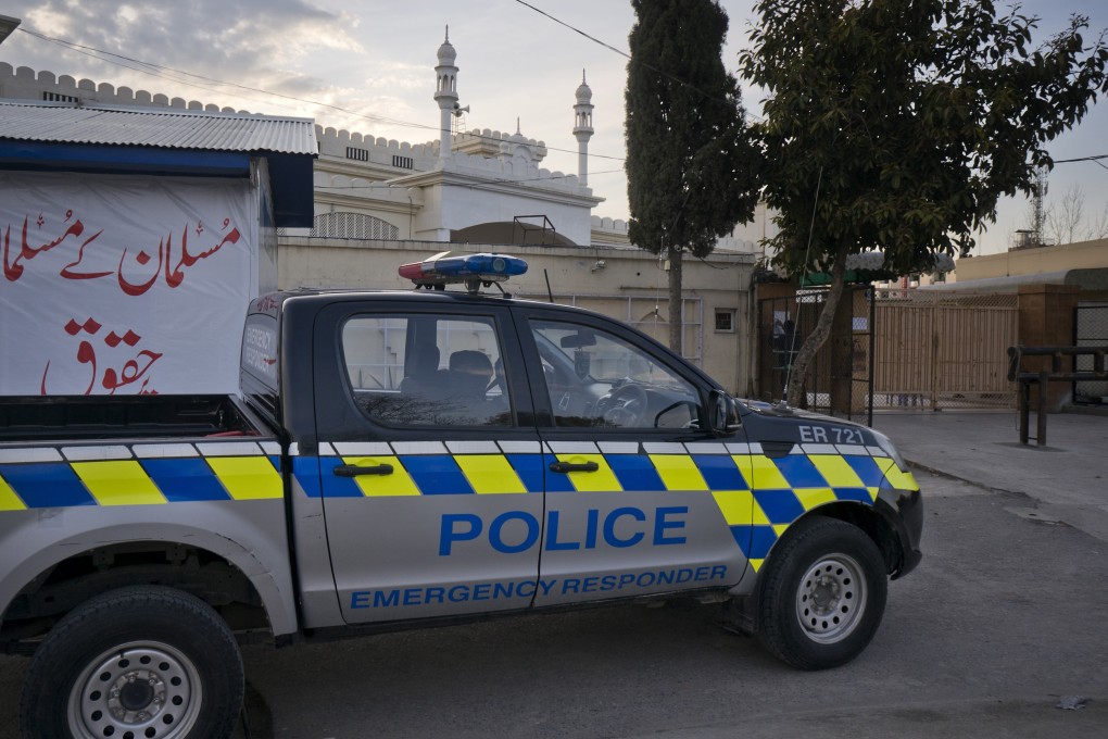 A police vehicle seen outside a mosque belonging to a banned religious group in Islamabad. Photo: AP