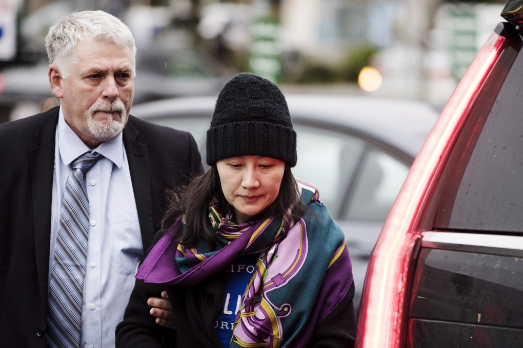 Huawei chief financial officer Meng Wanzhou arrives at a parole office with a security guard in Vancouver, British Columbia, in December 2018. Photo: AP