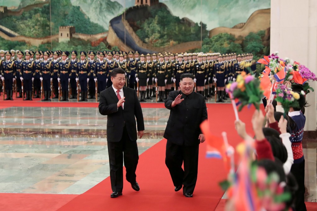 Chinese Foreign Minister Wang Yi says Beijing’s relations with Pyongyang have improved markedly in the last year with North Korean leader Kim Jong-un’s (right) four meetings with Chinese President Xi Jinping (left). Photo: Xinhua