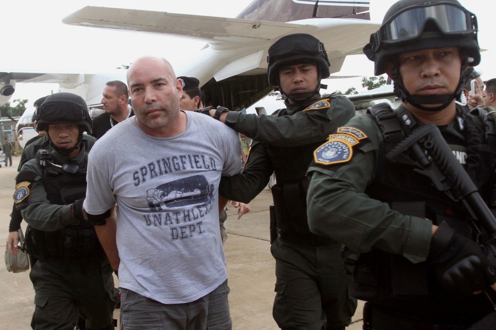 In this September 26, 2013 file photo, US mercenary Joseph Hunter is led away by Thai police commandos after being arrested in Bangkok. Photo: AP