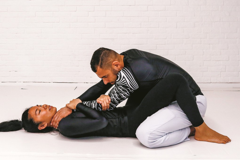 Brazilian jiu-jitsu expert Fernando Junior performs a demonstration of self-defence moves for women at the Li Dong Building in Central. Photo: Jonathan Wong