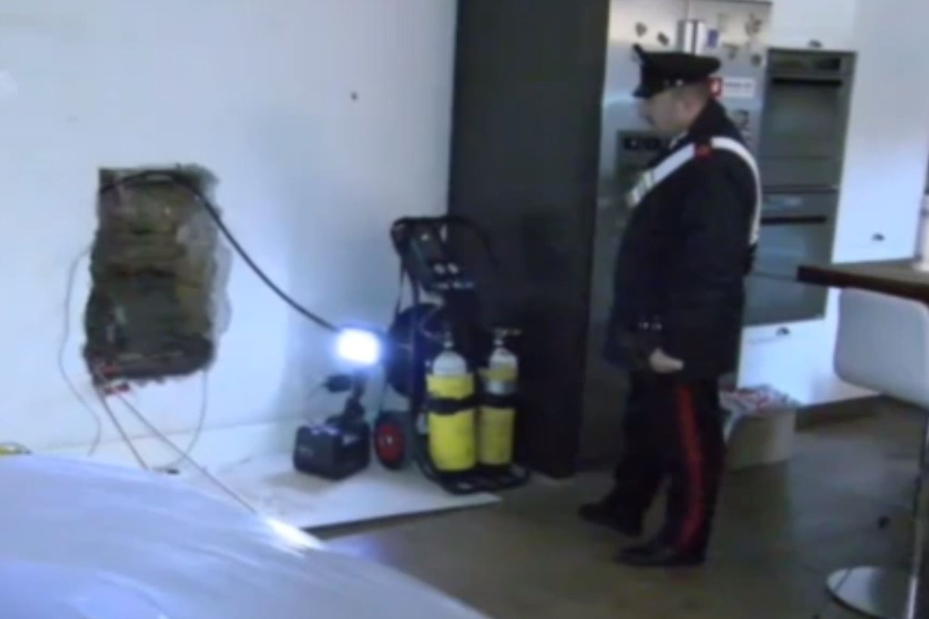Police at a villa in Senago, Italy, where the body of the man was found 'walled in' cement. Photo: La Repubblica