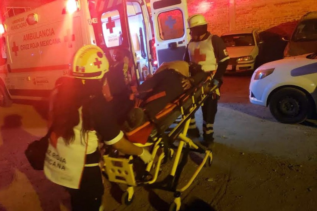 Rescuers help an injured person at the scene of a shooting at a nightclub in the municipality of Salamanca, central state of Guanajuato, Mexico, on Saturday. Photo: EPA-EFE