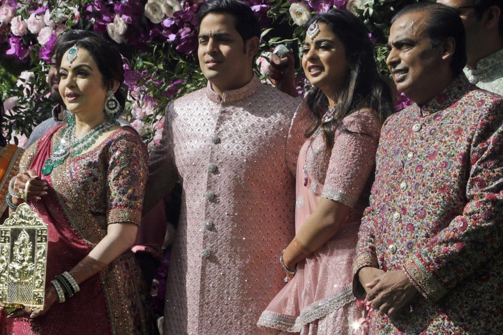 Reliance Industries Chairman Mukesh Ambani, right, with, from left, his wife, Nita, his son, Akash, and his daughter, Isha, arriving for Akash’s wedding in Mumbai, India, on Saturday. Photo: AP