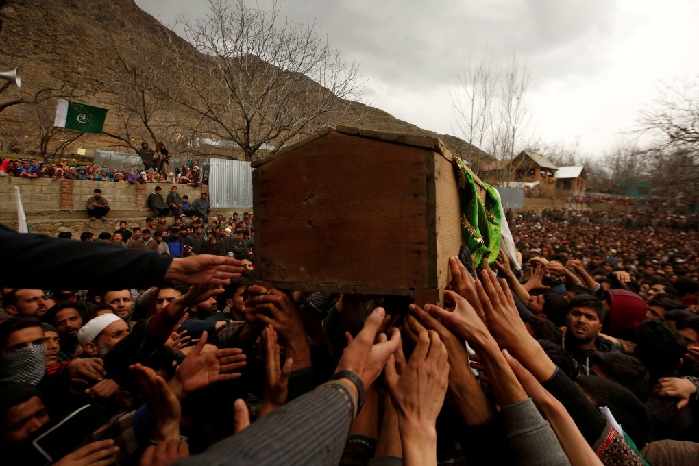 Mourners carry the coffin containing Mudasir Khan, a suspected militant. Photo: Reuters