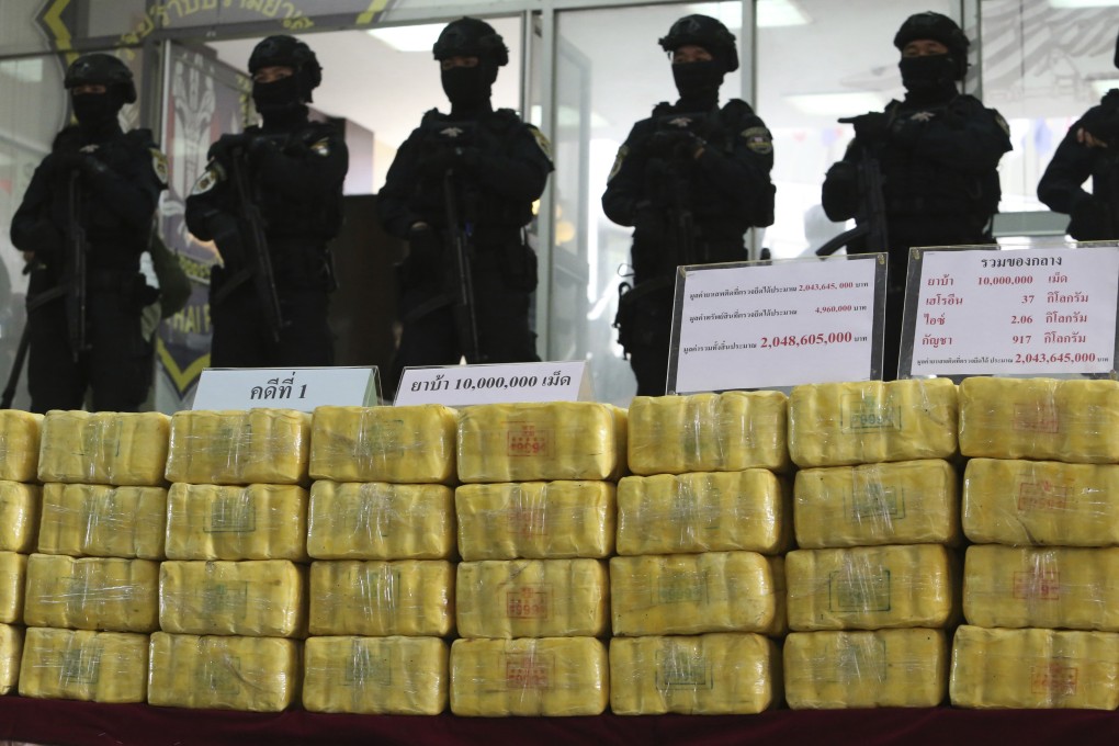 Thai policemen at a press conference showing seized methamphetamine pills in Bangkok. Photo: AP Photo