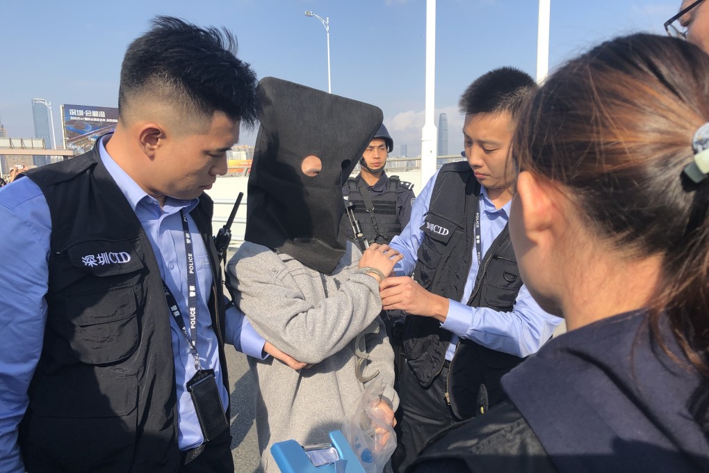 Guangdong provincial police prepare to hand over a fugitive to their counterparts in Hong Kong at the Huanggang port in Shenzhen in December 2018. Photo: Hong Kong Police