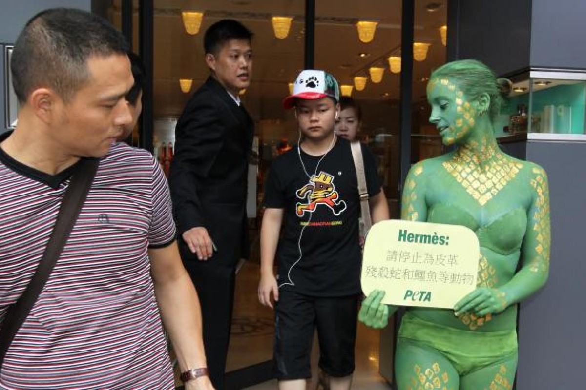 Topless dead ostrich protest at flagship store ruffles Hermès