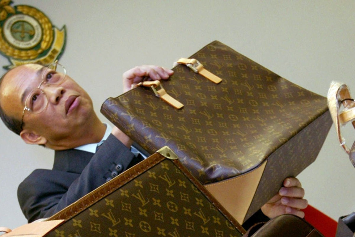 FILE--Fake Louis Vuitton handbags are confiscated at a warehouse