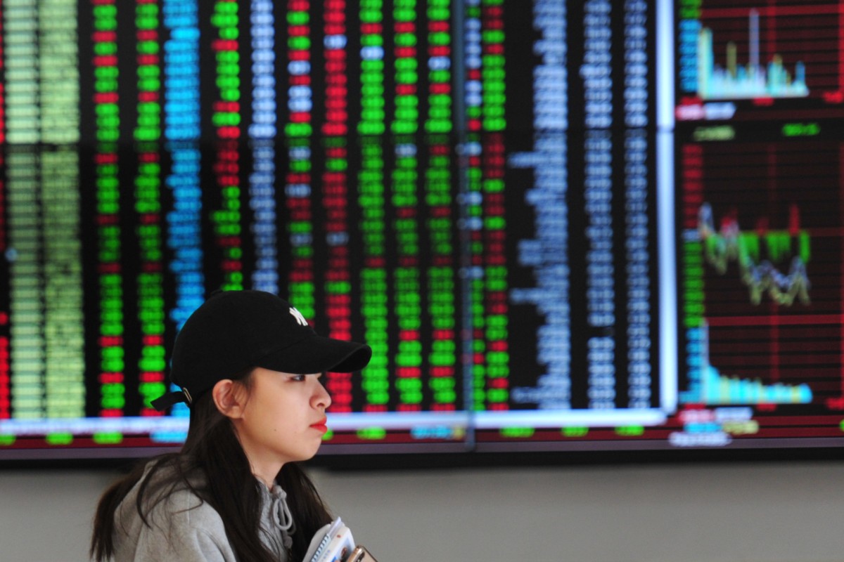 A woman stands at a brokerage firm in Shenyang, China April 11, 2019. Photo: CNA