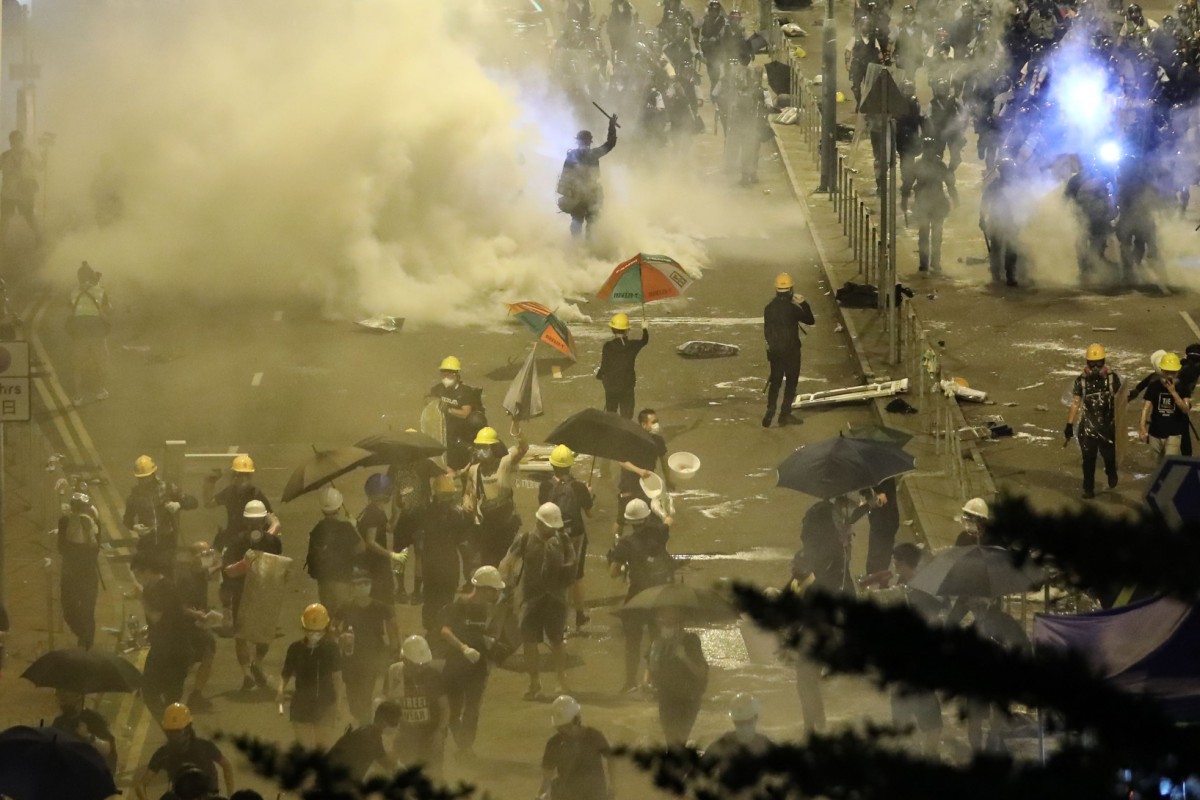 Police fire tear gas to disperse protesters after a day of violence Photo: Sam Tsang