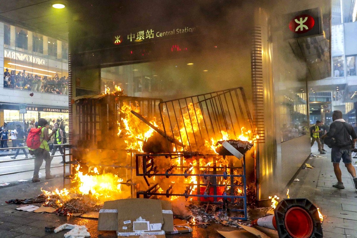Protesters set a fire at Central subway station on Sunday, in the business heart of Hong Kong. Photo: Edmond So