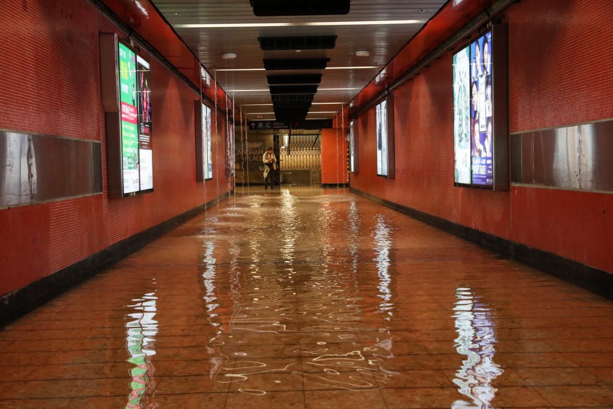 A corridor in Mong Kok MTR station is turned into a mini river as protesters break in and vandalise facilities, setting off water sprinklers and a fire hose. Photo: Sam Tsang