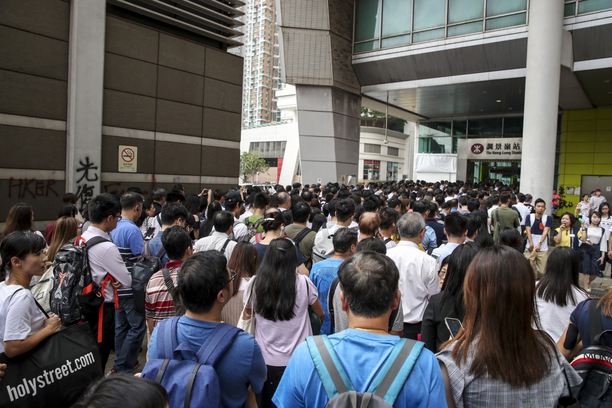 Commuters queue up at Tiu Keng Leng MTR Station after a chaotic weekend in which protests led to the closing of more than a dozen stations. Photo: Winson Wong